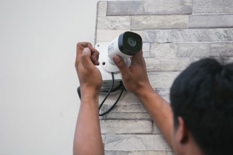 man installing alarm