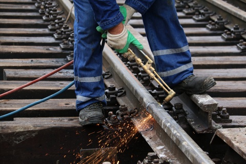 railroad worker soldering track