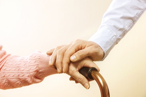 caregiver and elderly hands