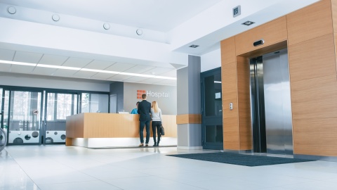 couple standing at hospital reception