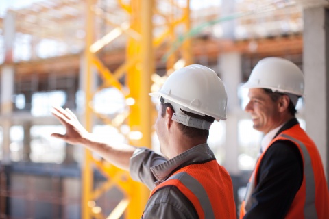 contractors looking at building site