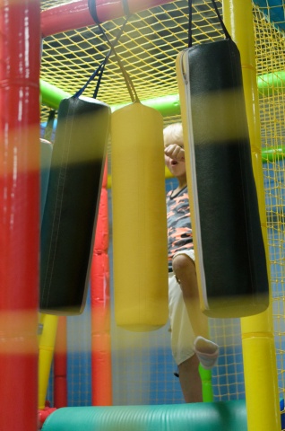 kid playing in bouncy house