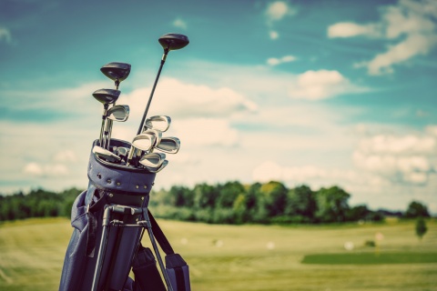 golf clubs on fairway