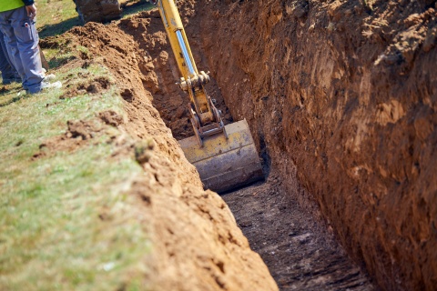 excavator digging trench