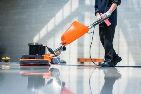 commercial cleaner mopping floor